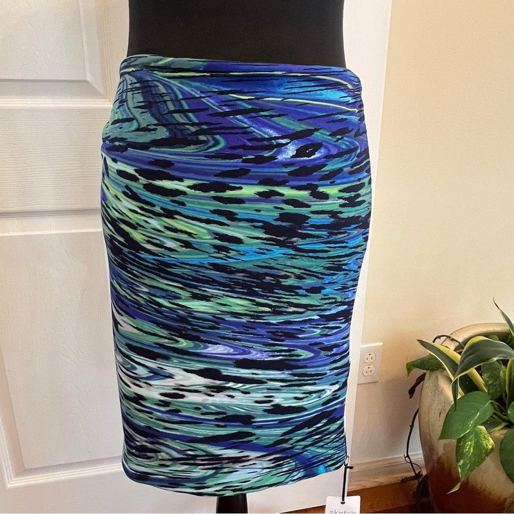 Scooby skirt ,tube top ,and scarf. It’s totally reversible NWT size Medium